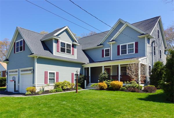 75 Deerfield Road Needham, MA 02492 - Photo 1 of 27 a front view of a house with a yard and porch