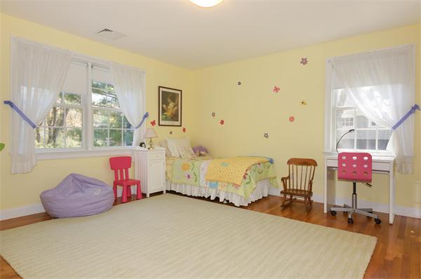 75 Deerfield Road Needham, MA 02492 - Photo 18 of 27 a spacious bedroom with a bed and wooden floor