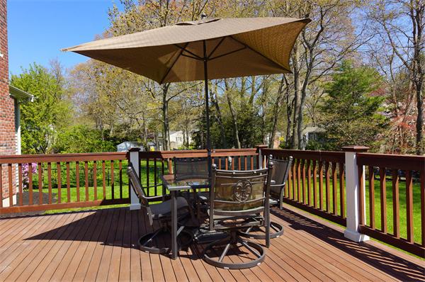 75 Deerfield Road Needham, MA 02492 - Photo 22 of 27 a view of balcony with furniture and umbrella