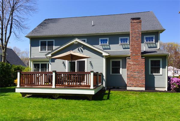 75 Deerfield Road Needham, MA 02492 - Photo 24 of 27 a front view of a house with a garden