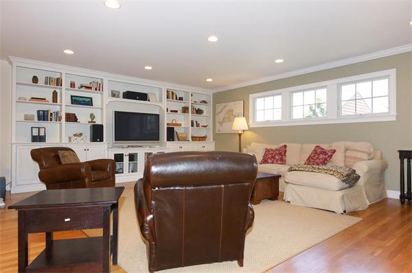75 Deerfield Road Needham, MA 02492 - Photo 7 of 27 a living room with furniture a flat screen tv and a window