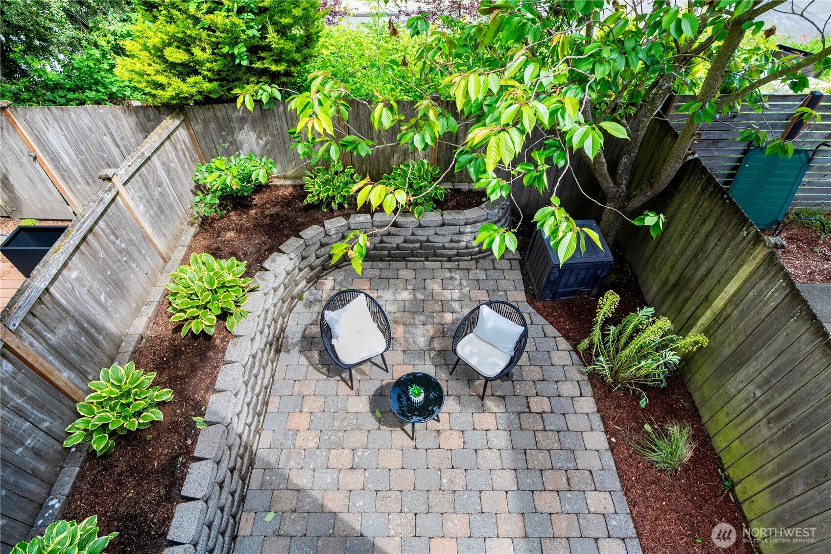 6348 34th Avenue Southwest, Unit C Seattle, WA 98126 - Photo 15 of 24 a view of a back yard with potted plants