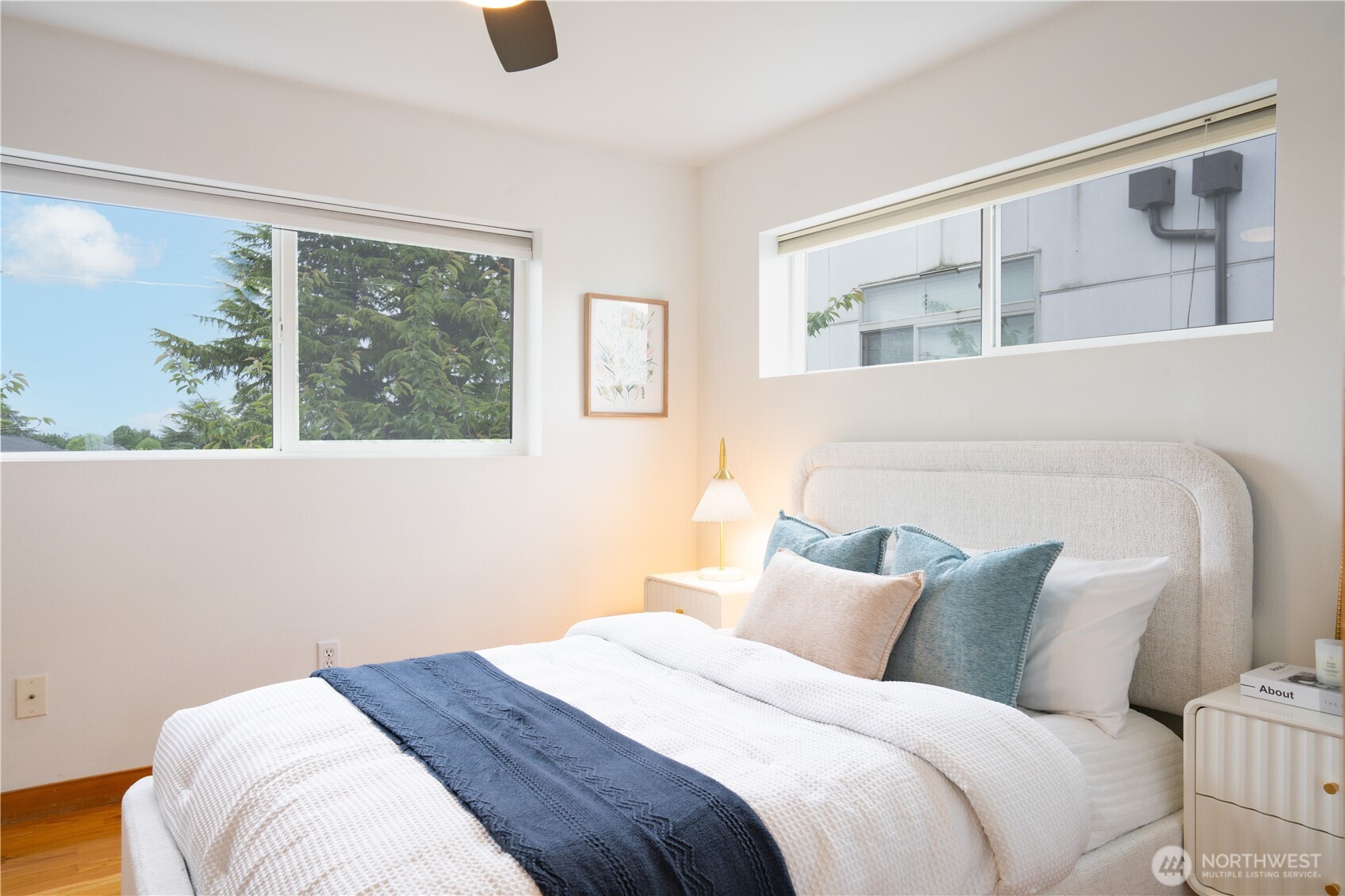 6348 34th Avenue Southwest, Unit C Seattle, WA 98126 - Photo 16 of 24 a bedroom with a large bed and a window