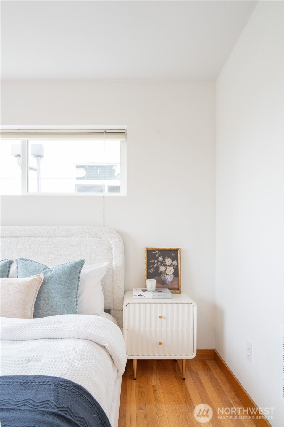 6348 34th Avenue Southwest, Unit C Seattle, WA 98126 - Photo 17 of 24 a living room with a baby crib furniture and a window