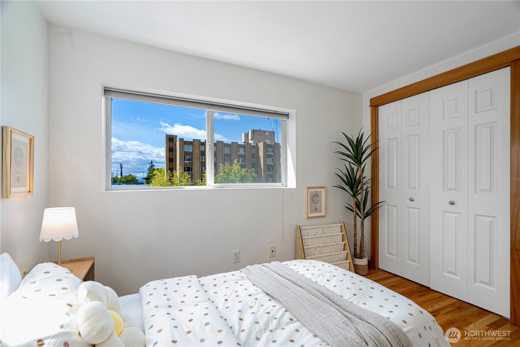 6348 34th Avenue Southwest, Unit C Seattle, WA 98126 - Photo 19 of 24 a bedroom with a bed and a window