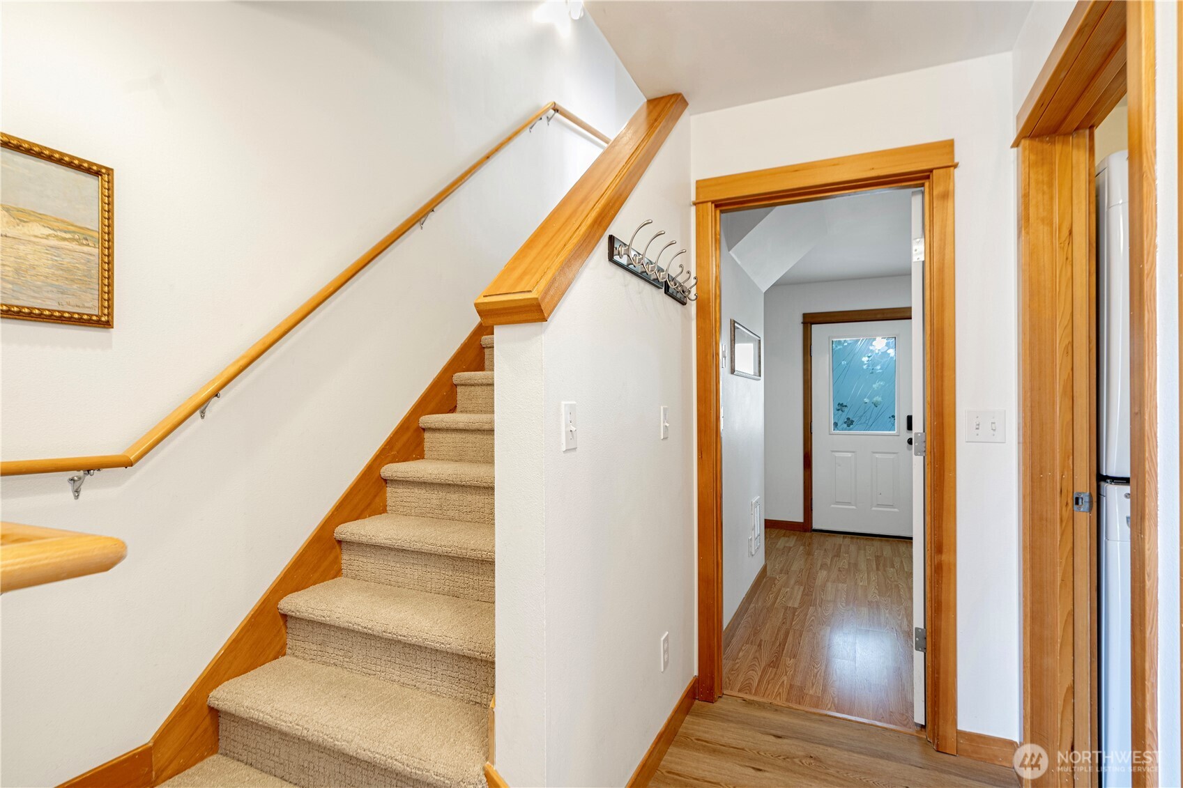 6348 34th Avenue Southwest, Unit C Seattle, WA 98126 - Photo 2 of 24 a view of an entryway with wooden floor and stairs