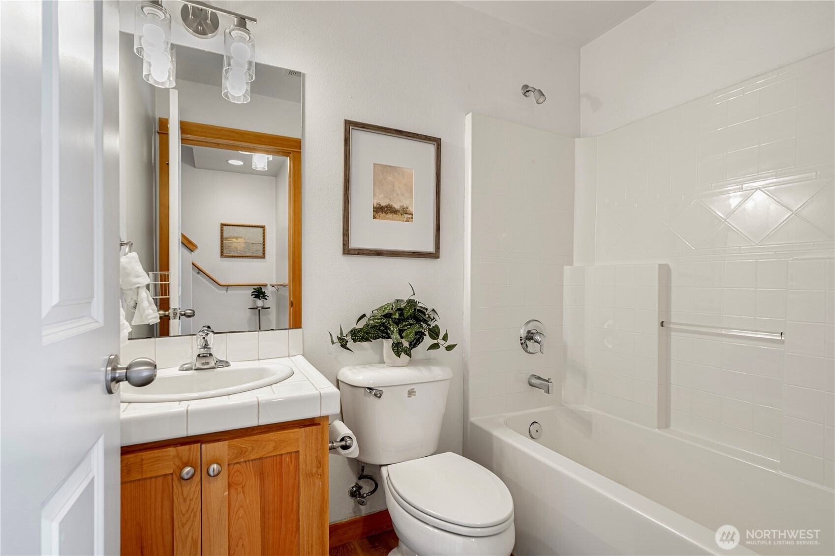 6348 34th Avenue Southwest, Unit C Seattle, WA 98126 - Photo 5 of 24 a bathroom with a sink toilet and shower