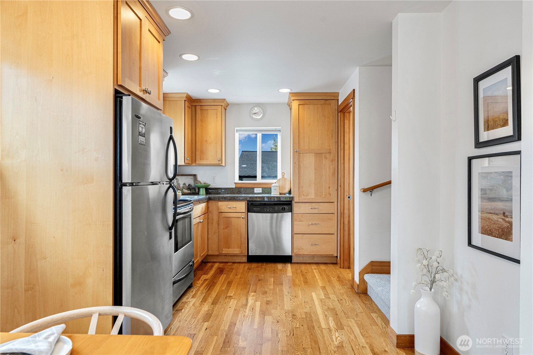 6348 34th Avenue Southwest, Unit C Seattle, WA 98126 - Photo 6 of 24 a kitchen with a refrigerator and a sink