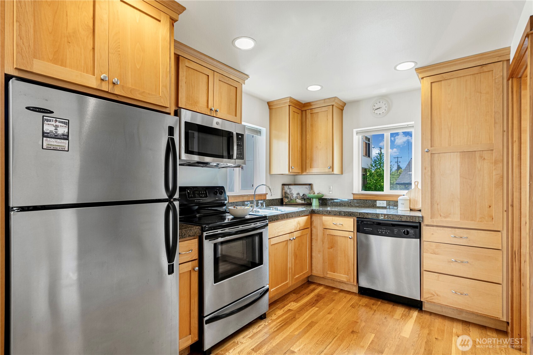 6348 34th Avenue Southwest, Unit C Seattle, WA 98126 - Photo 8 of 24 a kitchen with a refrigerator stove and sink