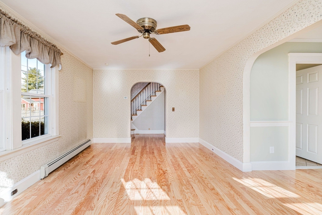 31 South Main Street Bellingham, MA 02019 - Photo 11 of 41 a view of empty room with wooden floor and window