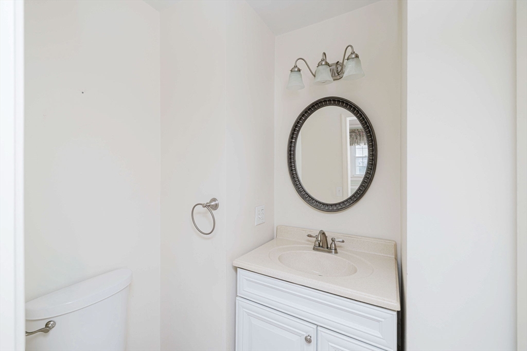 31 South Main Street Bellingham, MA 02019 - Photo 20 of 41 a bathroom with a sink and a mirror