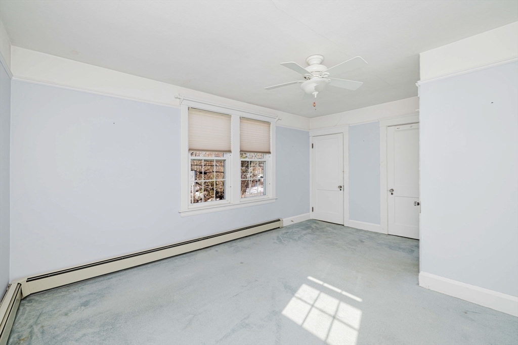 31 South Main Street Bellingham, MA 02019 - Photo 24 of 41 an empty room with windows and fan