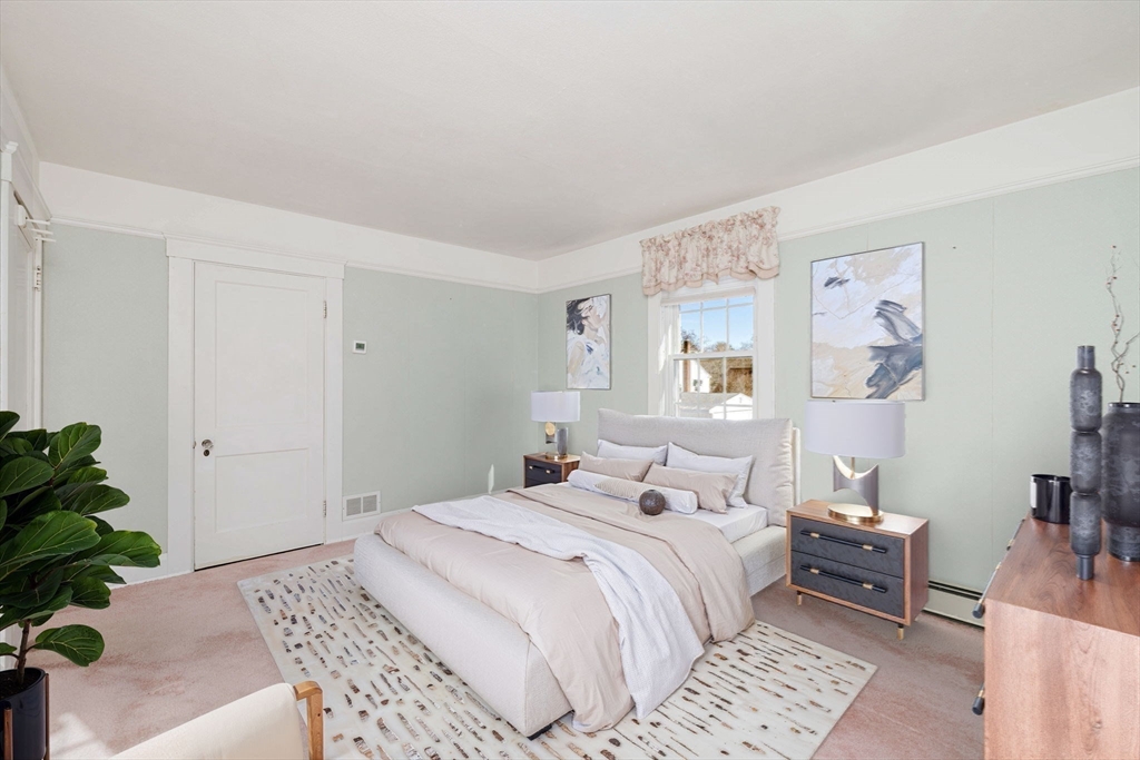31 South Main Street Bellingham, MA 02019 - Photo 25 of 41 a bedroom with a bed and a couch