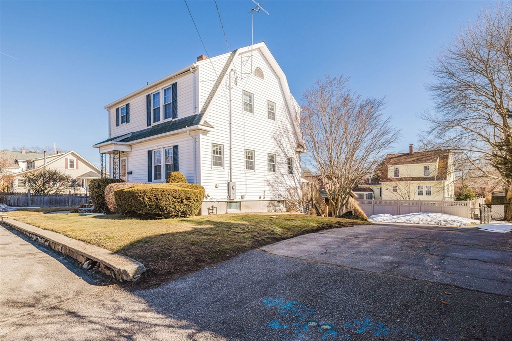 31 South Main Street Bellingham, MA 02019 - Photo 3 of 41 a front view of a house with a yard