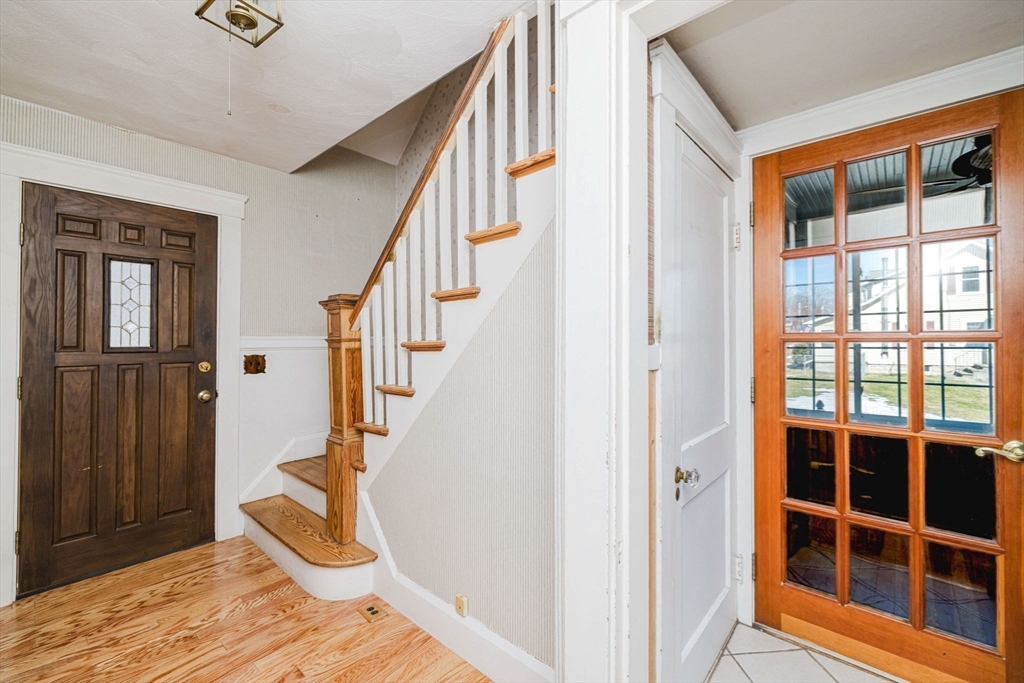 31 South Main Street Bellingham, MA 02019 - Photo 7 of 41 a view of entryway with wooden floor and stairs