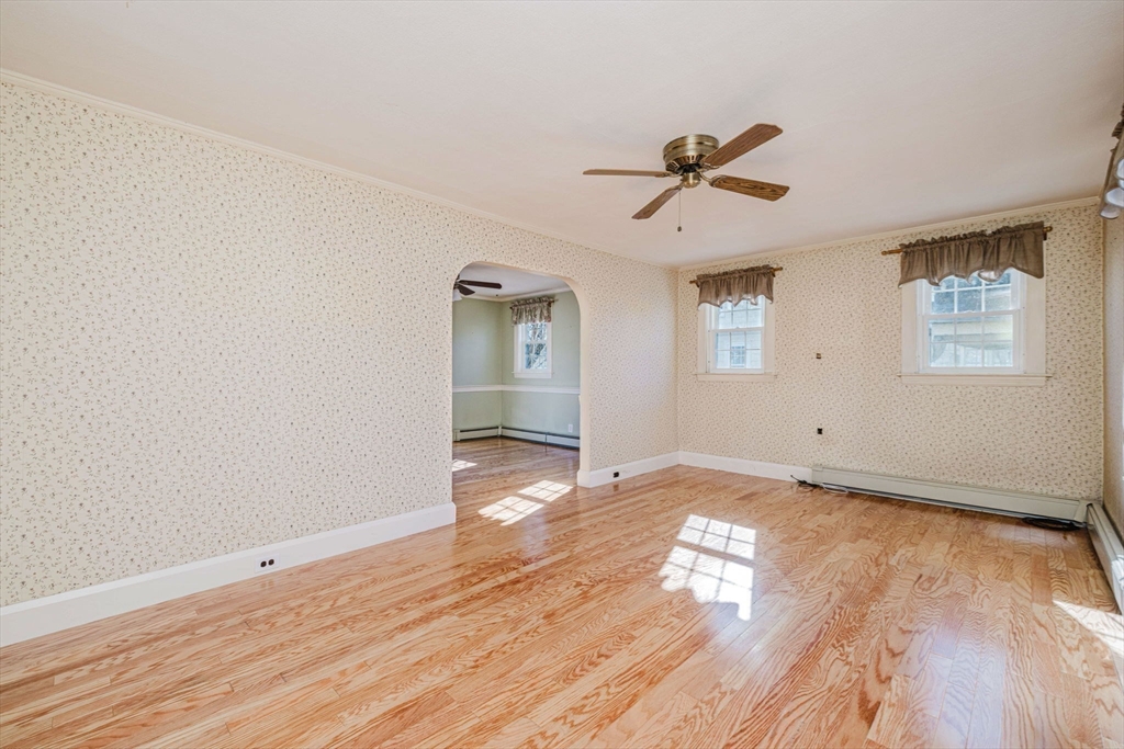 31 South Main Street Bellingham, MA 02019 - Photo 9 of 41 an empty room with wooden floor and windows