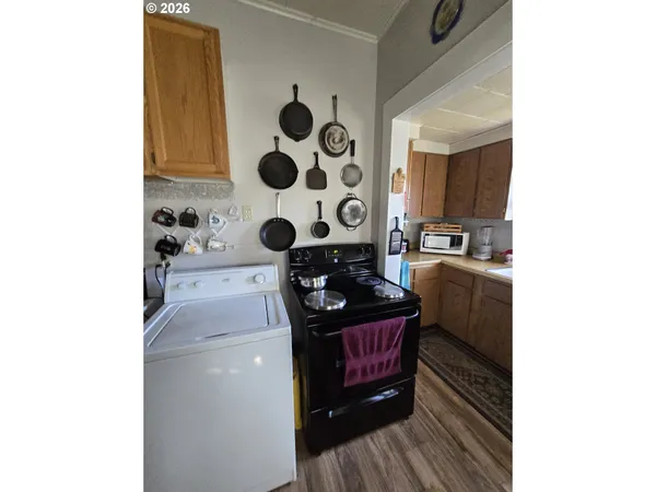 a view of a livingroom with furniture and a workspace