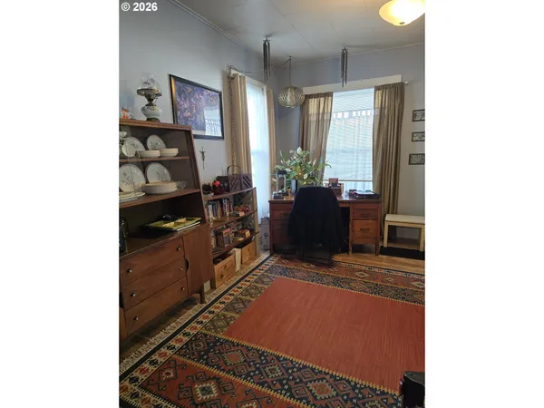 a large white kitchen with a stove a sink and a refrigerator