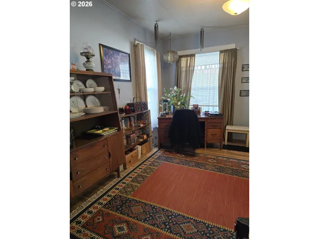 a large white kitchen with a stove a sink and a refrigerator