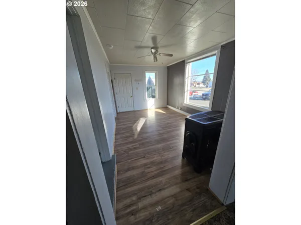 a view of a hallway with windows