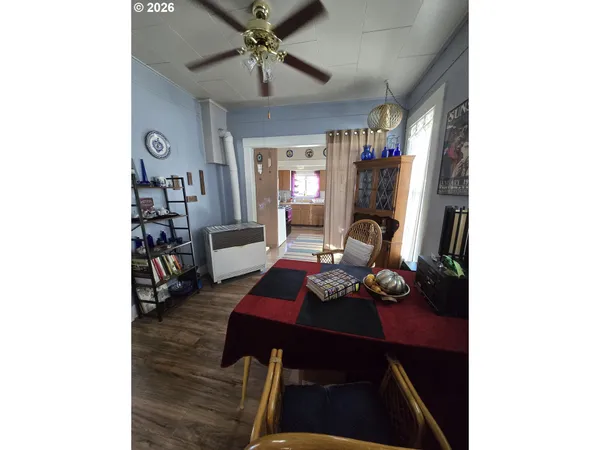 a dining room with furniture and window