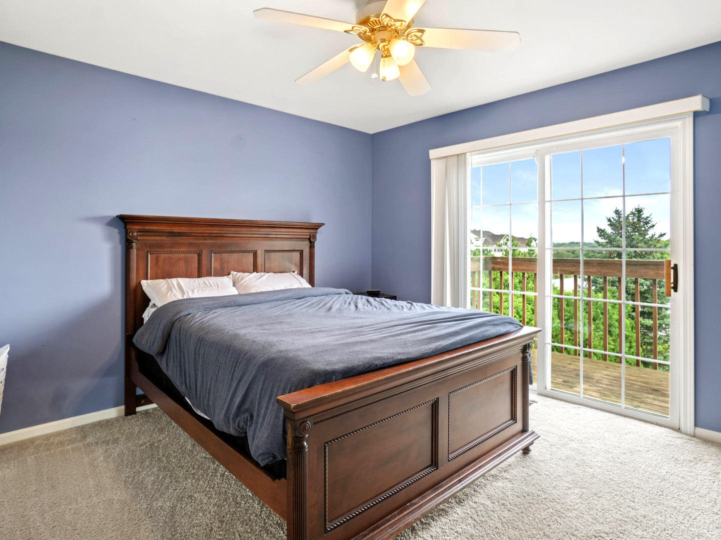 18714 West Lazy Acre Road Lake Villa, IL 60046 - Photo 16 of 36 a bed sitting in a bedroom next to a window