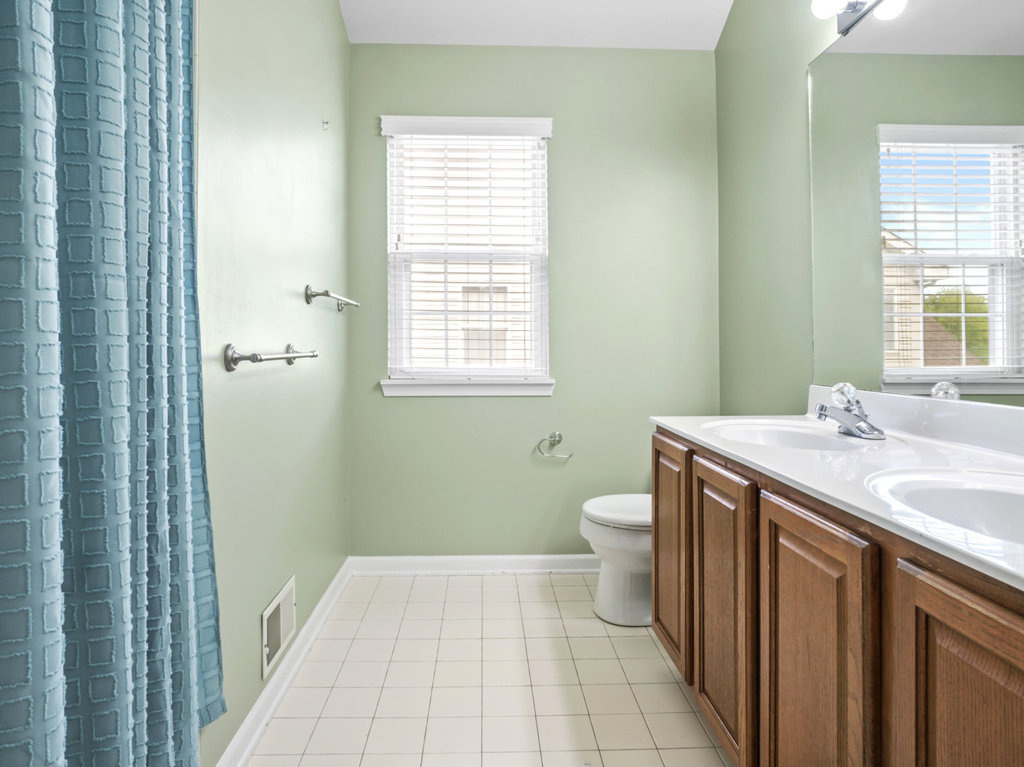 18714 West Lazy Acre Road Lake Villa, IL 60046 - Photo 19 of 36 a bathroom with a sink a toilet and a window