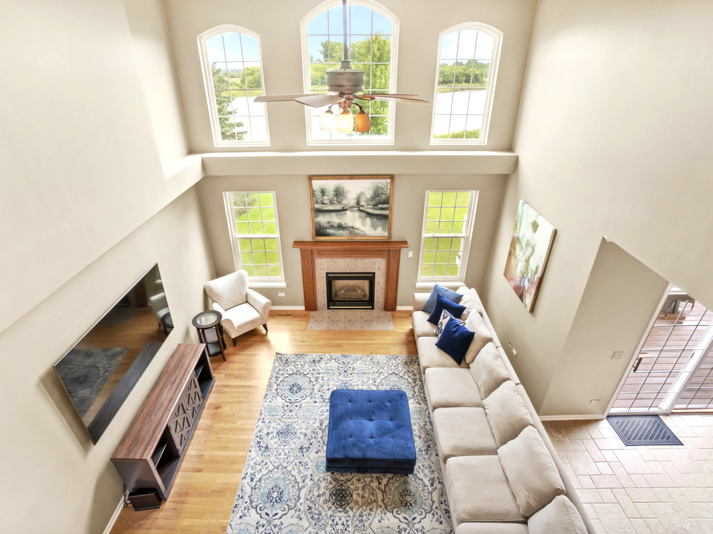 18714 West Lazy Acre Road Lake Villa, IL 60046 - Photo 3 of 36 a living room with furniture and a fireplace