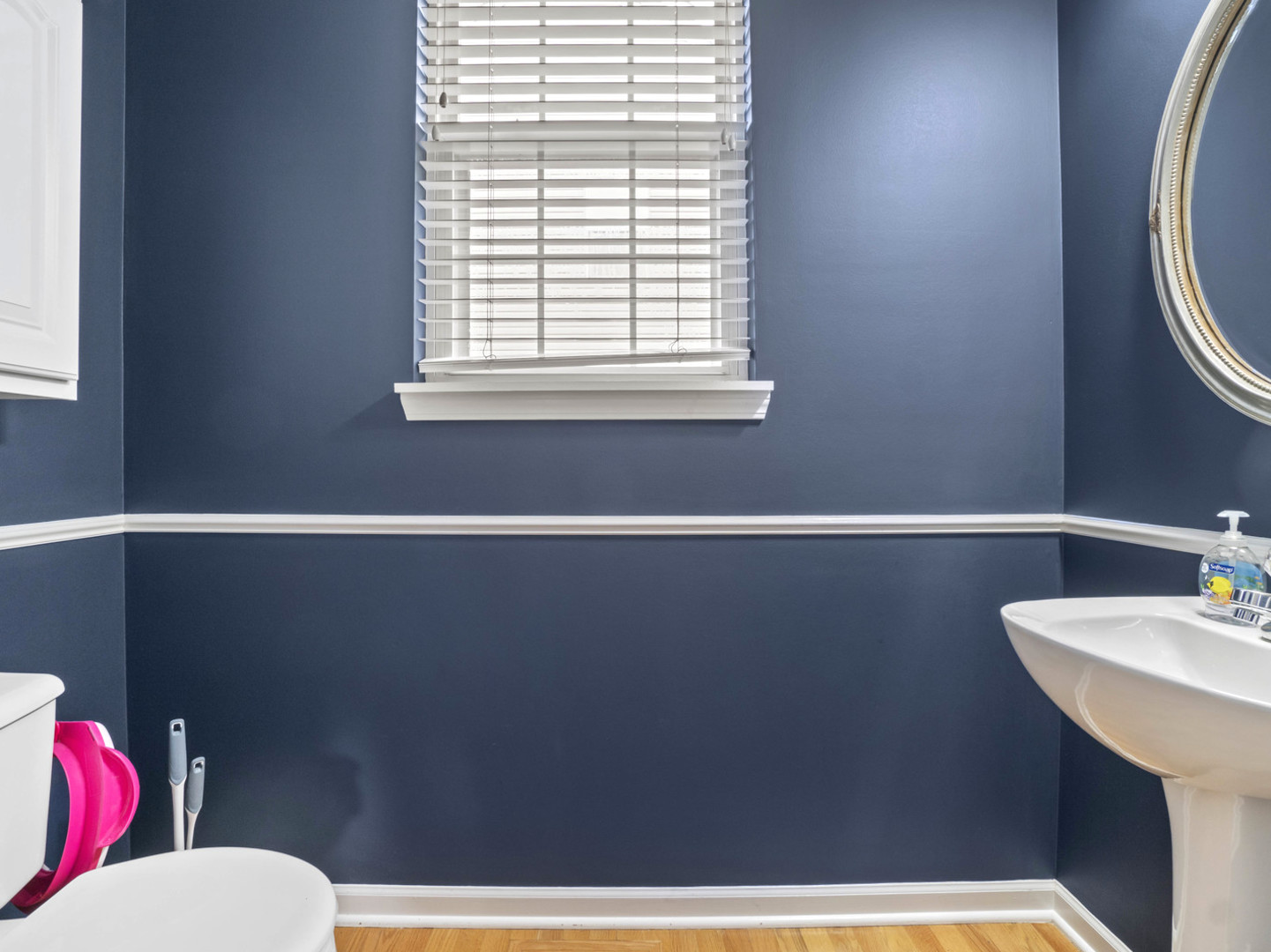 18714 West Lazy Acre Road Lake Villa, IL 60046 - Photo 10 of 36 a bathroom with a toilet a sink and a window