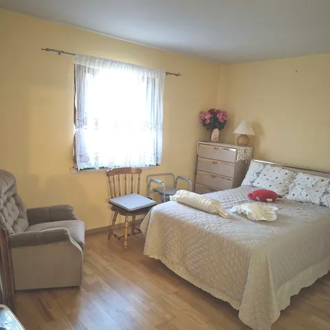 a bedroom with a bed and a couch