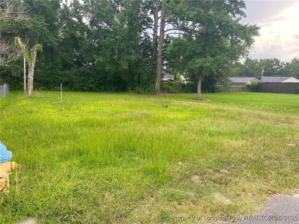 604 Middle Street Lumberton, NC 28358 - Photo 1 of 6 a view of outdoor space with deck and yard
