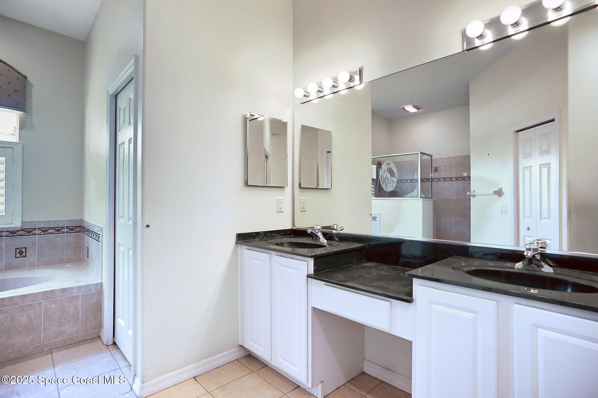 5357 Solway Drive Melbourne Beach, FL 32951 - Photo 11 of 31 a kitchen with a sink and a refrigerator