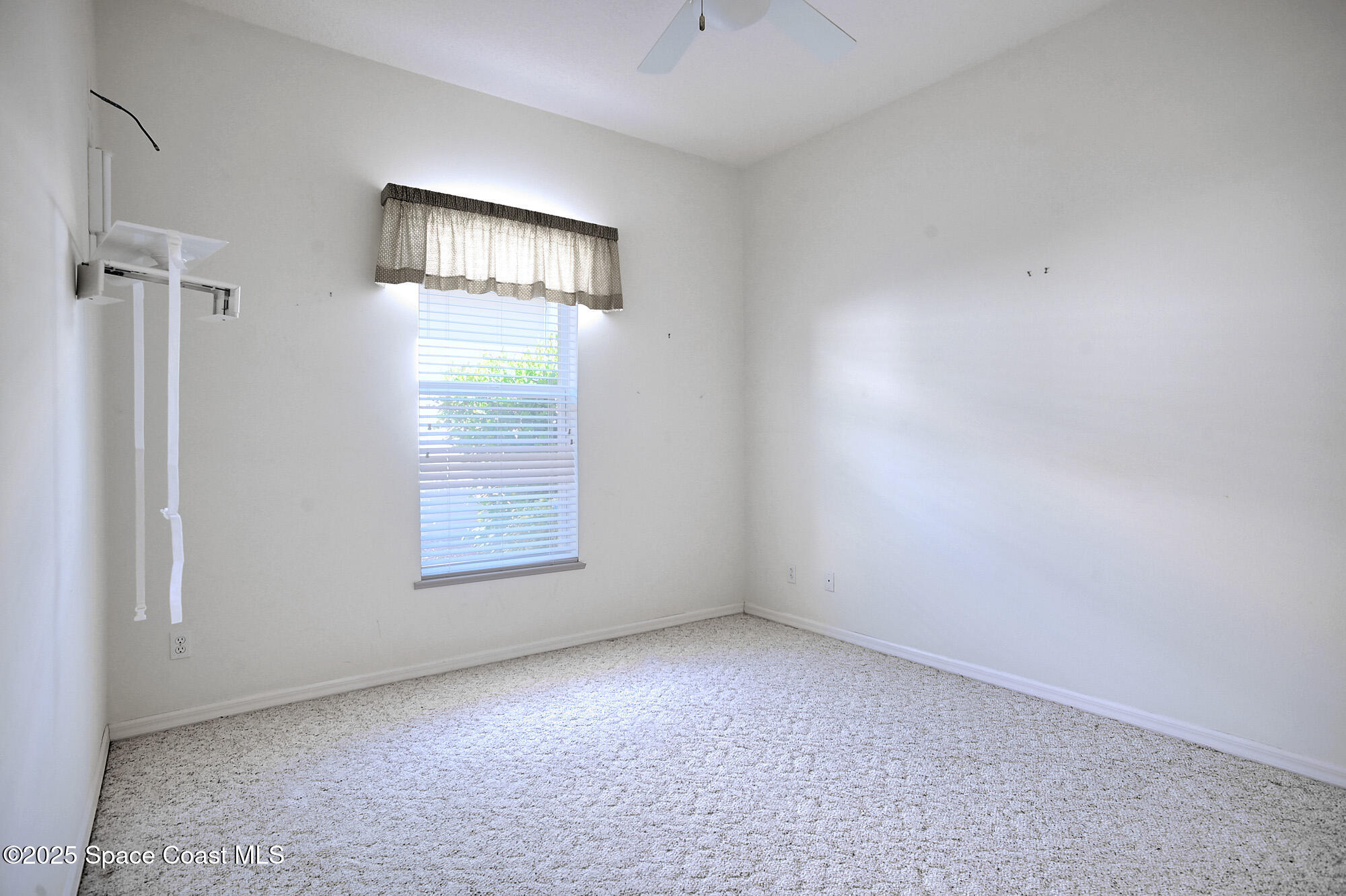 5357 Solway Drive Melbourne Beach, FL 32951 - Photo 13 of 31 a view of an empty room with a window