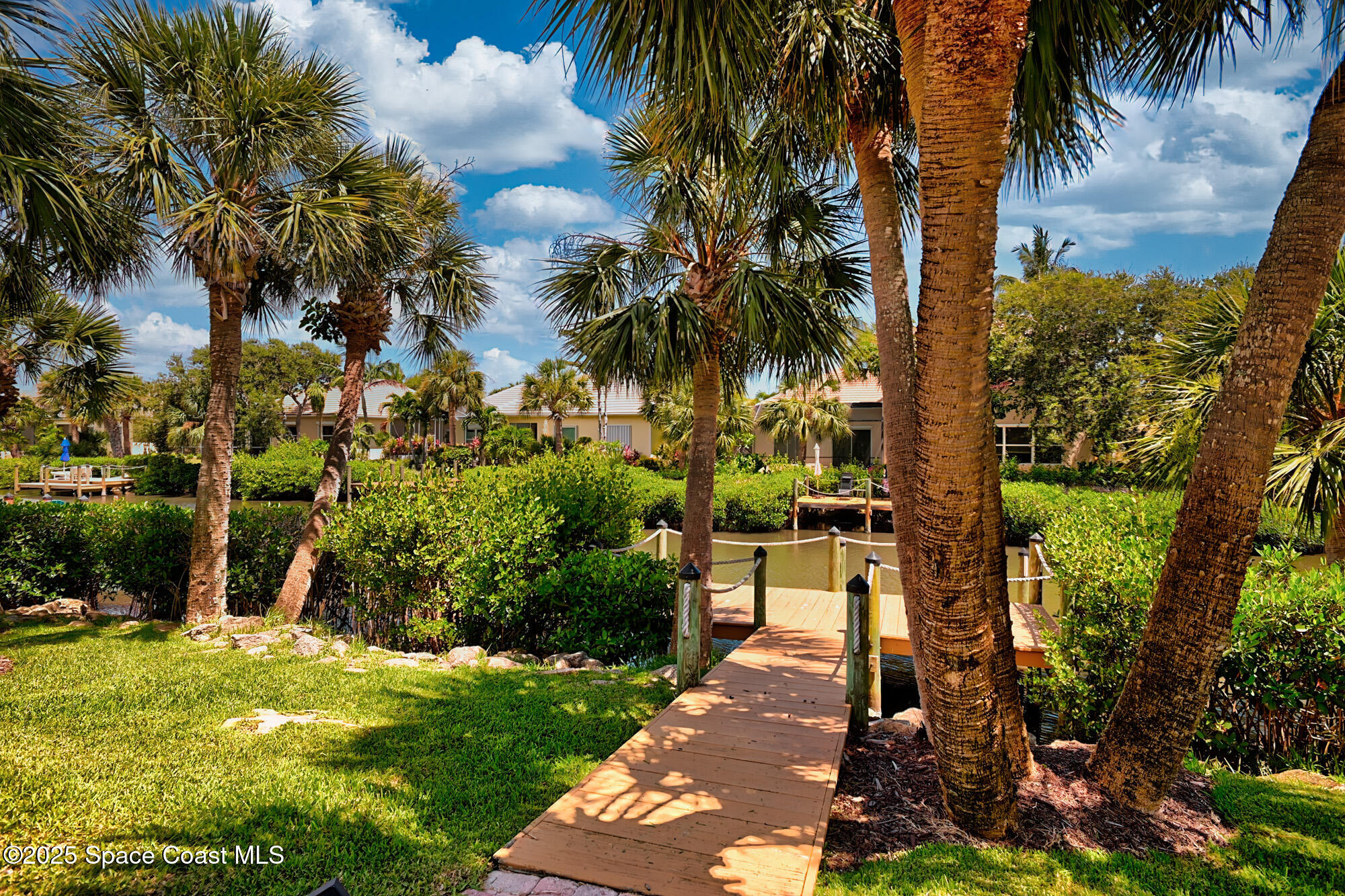 5357 Solway Drive Melbourne Beach, FL 32951 - Photo 19 of 31 a view of a yard with palm tree