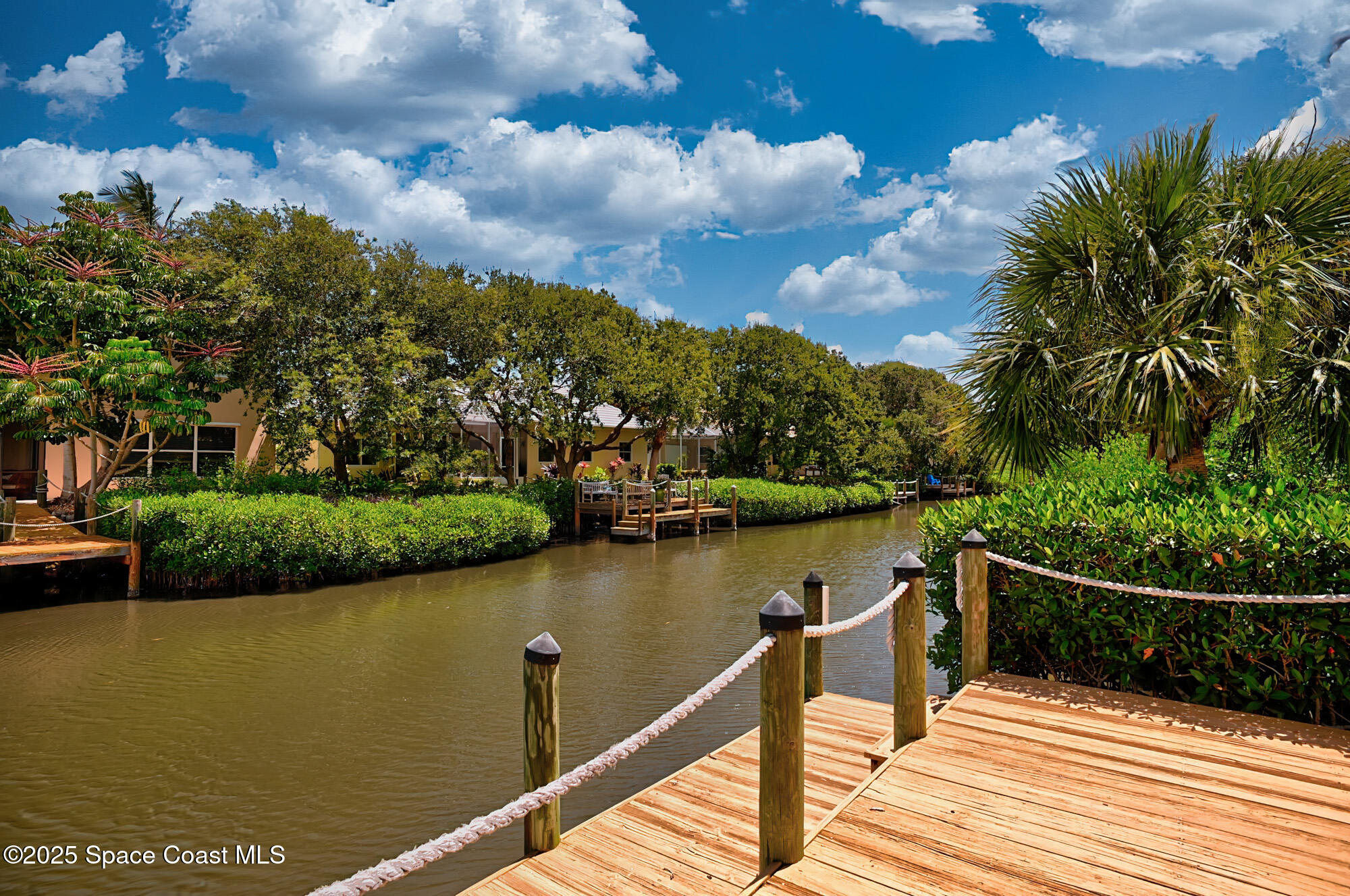 5357 Solway Drive Melbourne Beach, FL 32951 - Photo 20 of 31 a view of a lake with a wooden bridge