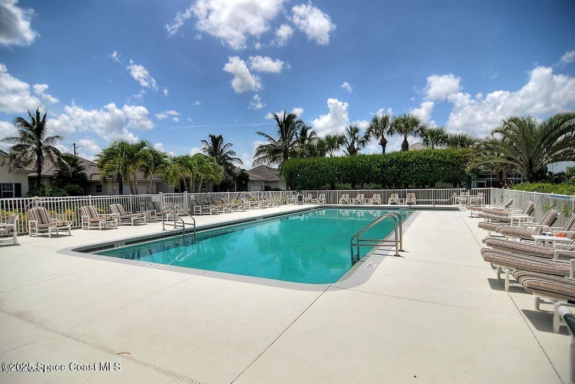 5357 Solway Drive Melbourne Beach, FL 32951 - Photo 23 of 31 a view of a swimming pool with a yard