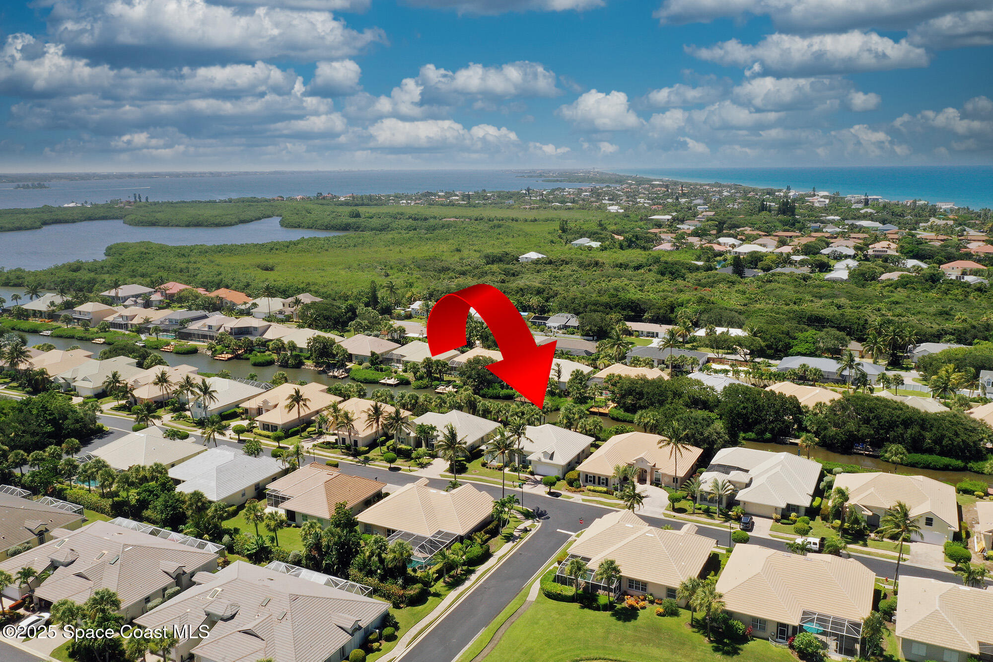 5357 Solway Drive Melbourne Beach, FL 32951 - Photo 25 of 31 an aerial view of residential houses with outdoor space and river