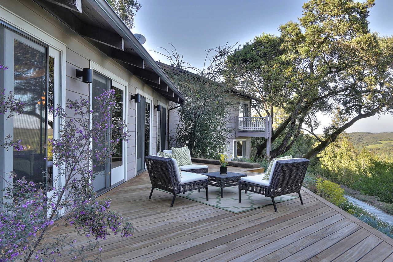 33 Montecito Road Woodside, CA 94062 - Photo 17 of 70 a view of a patio with table and chairs and wooden floor