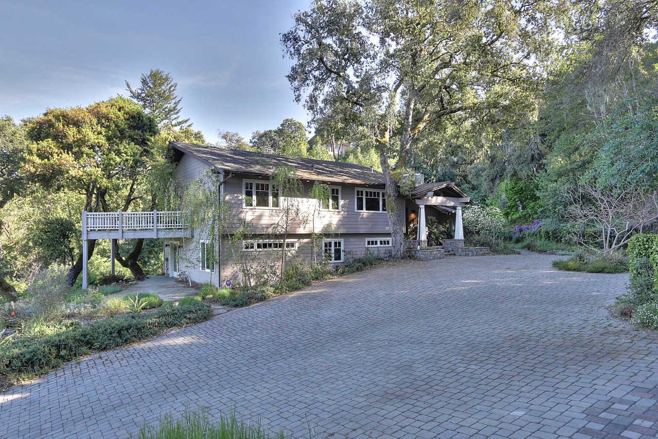 33 Montecito Road Woodside, CA 94062 - Photo 2 of 70 a front view of a house with a yard and shrubs