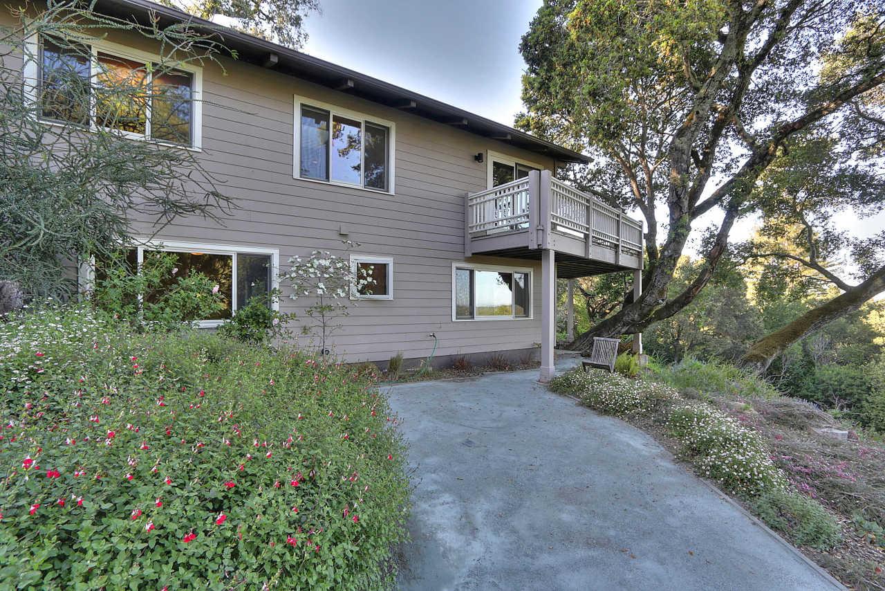 33 Montecito Road Woodside, CA 94062 - Photo 21 of 70 a front view of a house with a garden