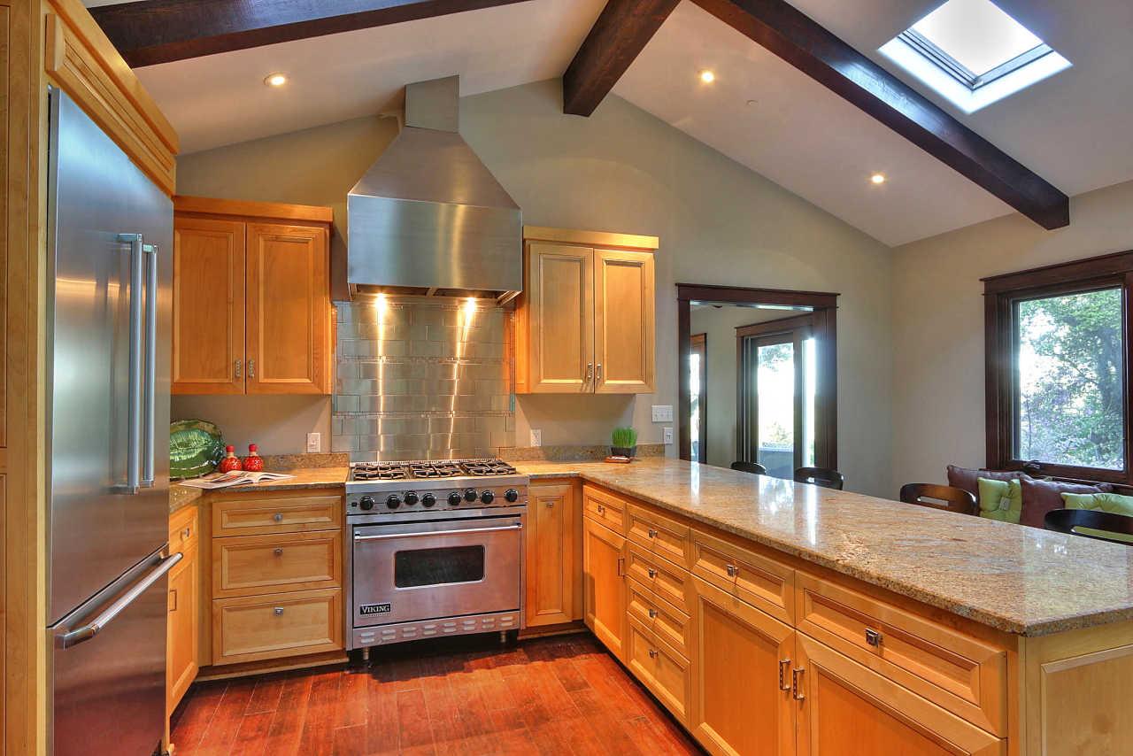33 Montecito Road Woodside, CA 94062 - Photo 42 of 70 a kitchen with stainless steel appliances a stove and a refrigerator