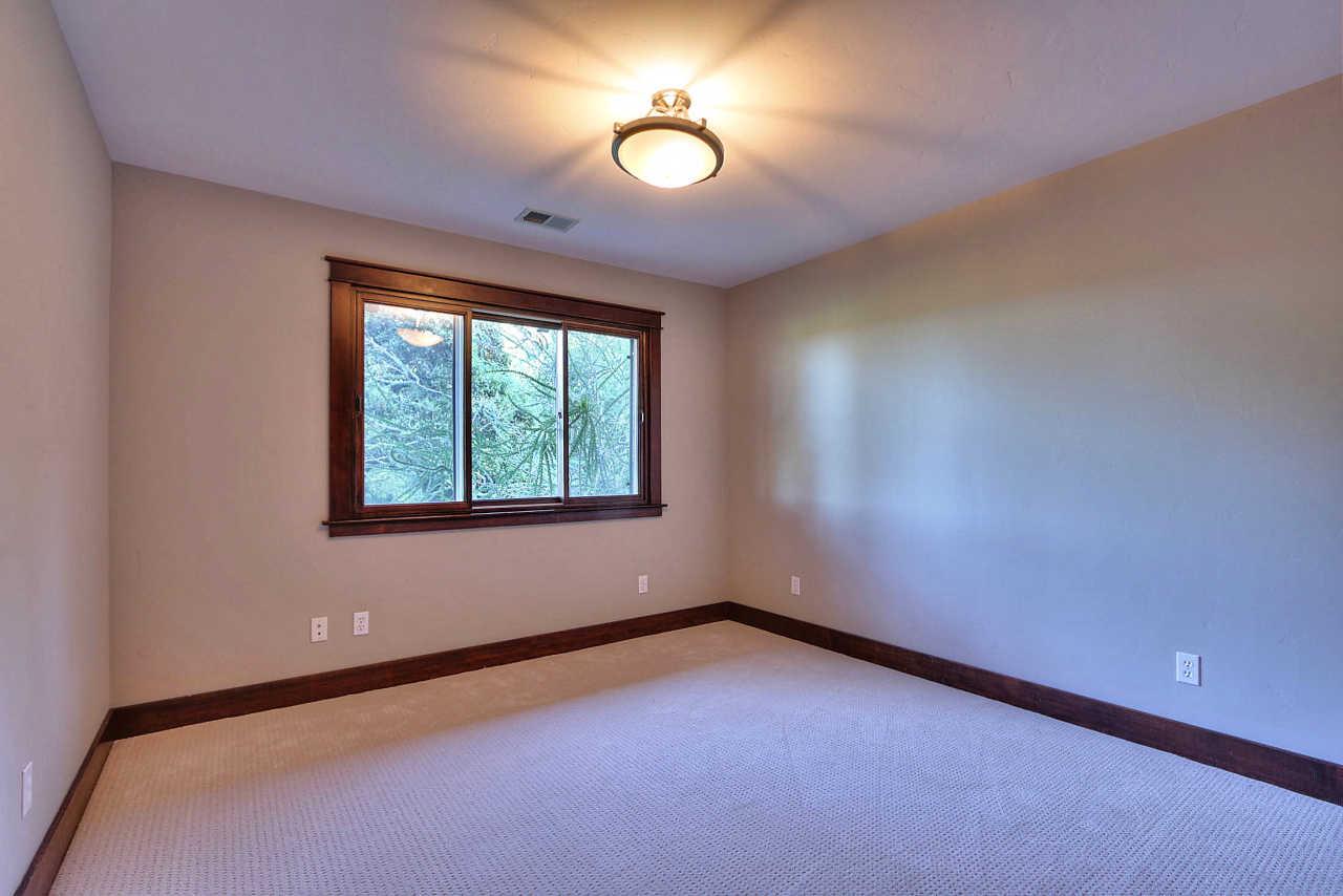 33 Montecito Road Woodside, CA 94062 - Photo 44 of 70 an empty room with a window and a fan