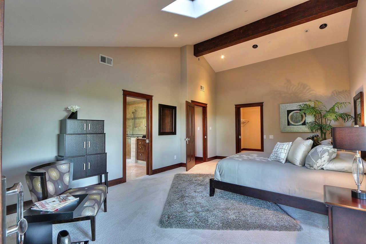 33 Montecito Road Woodside, CA 94062 - Photo 50 of 70 a bedroom with a bed and wooden floor