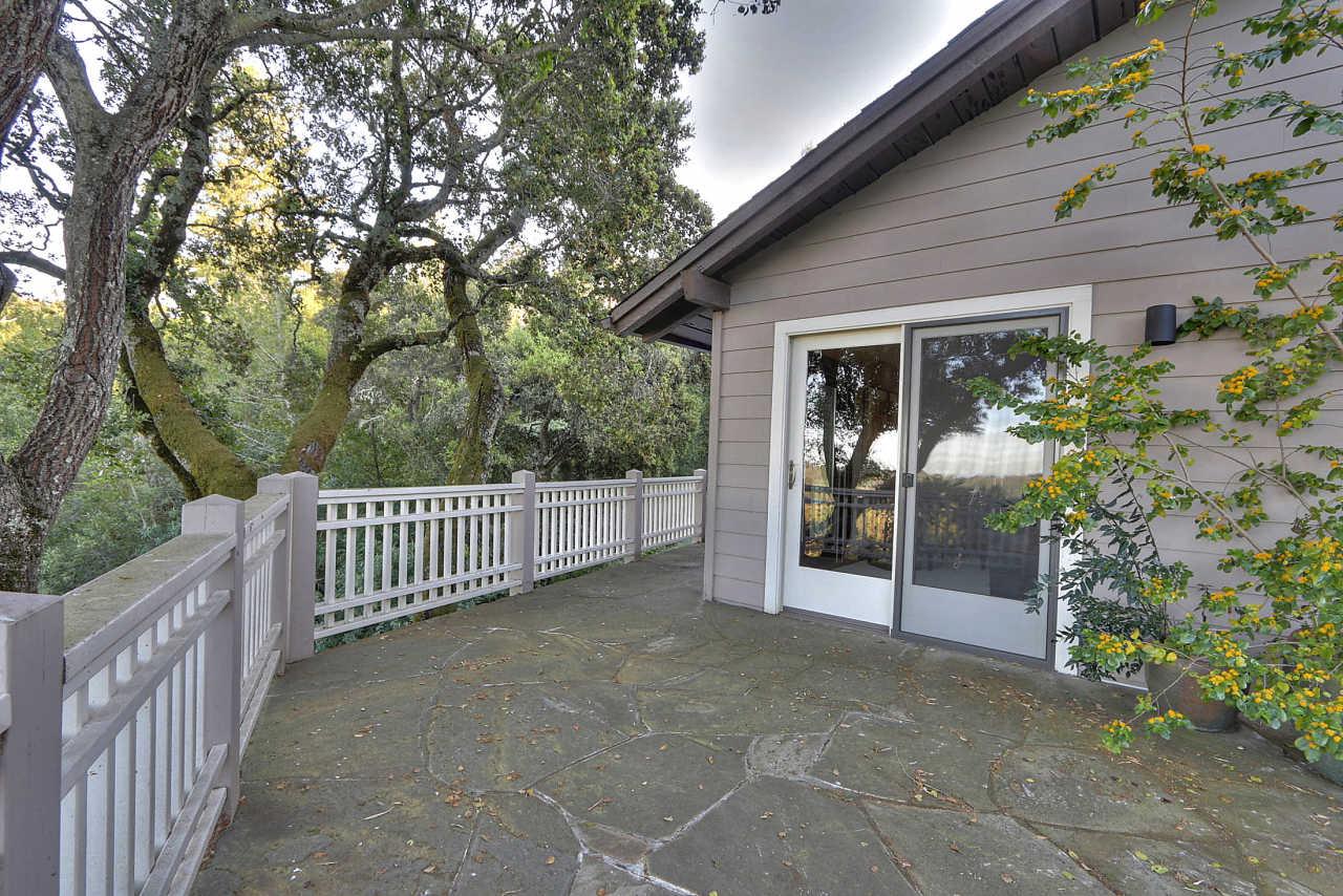 33 Montecito Road Woodside, CA 94062 - Photo 57 of 70 a view of a house with a porch and furniture