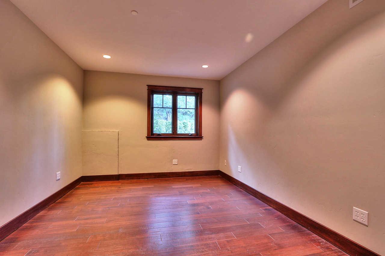 33 Montecito Road Woodside, CA 94062 - Photo 63 of 70 an empty room with wooden floor and windows