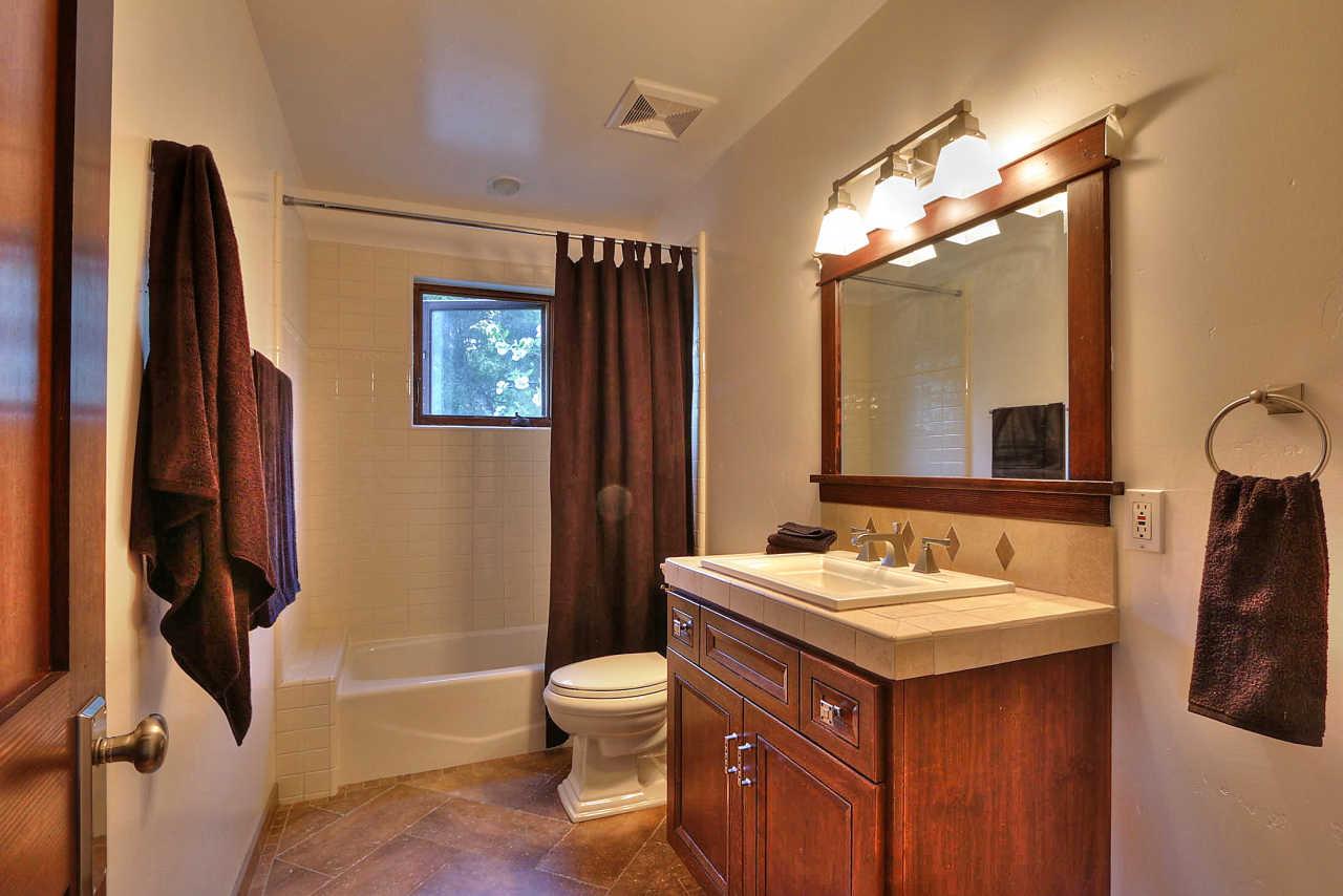 33 Montecito Road Woodside, CA 94062 - Photo 65 of 70 a bathroom with a sink and a mirror