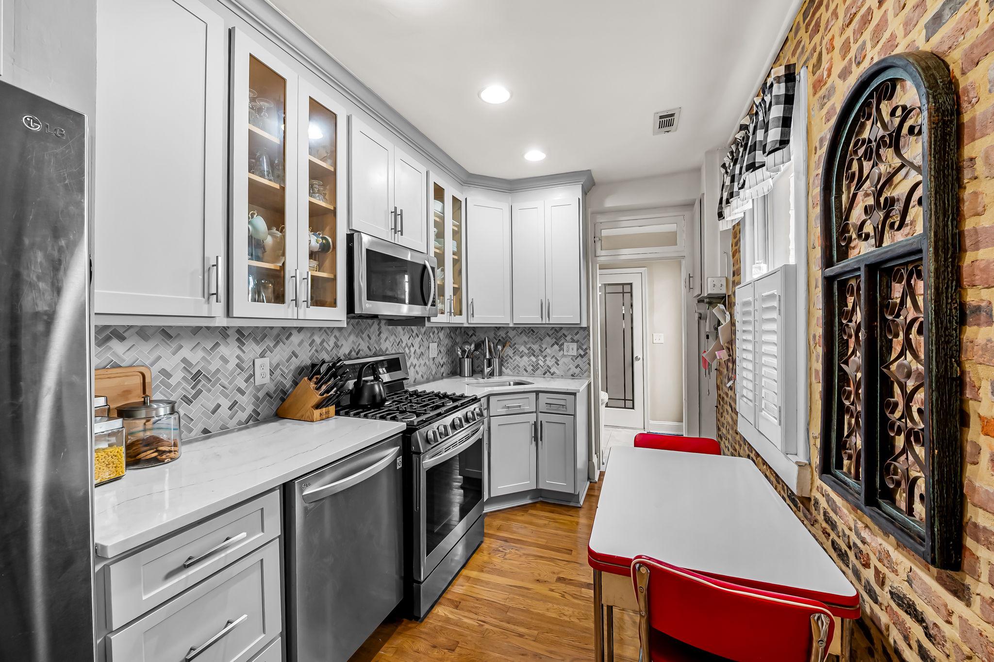 3134 Elliott Street Baltimore, MD 21224 - Photo 11 of 34 a kitchen with stainless steel appliances granite countertop a stove and a sink