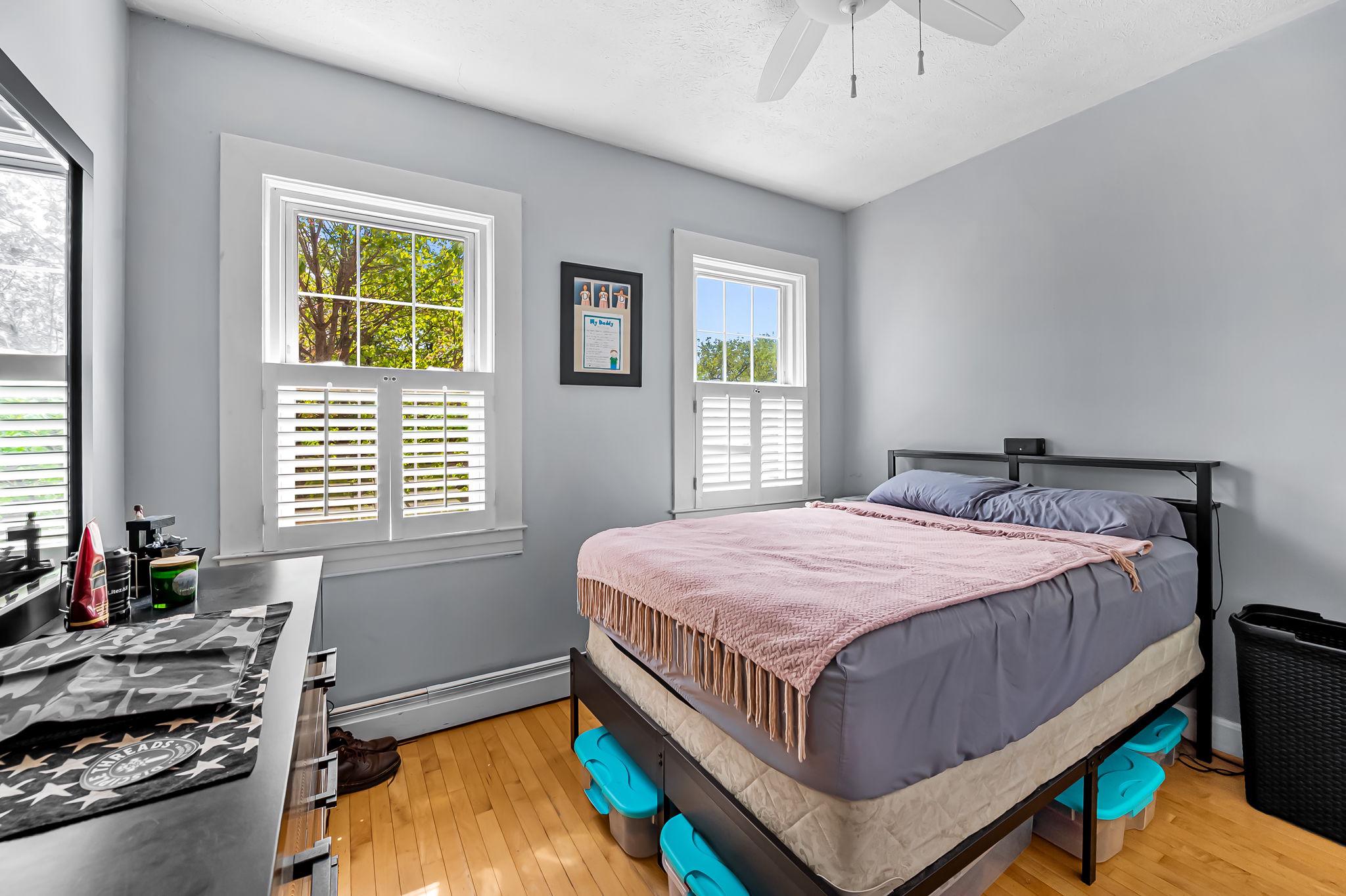 3134 Elliott Street Baltimore, MD 21224 - Photo 17 of 34 a bedroom with a bed and a window