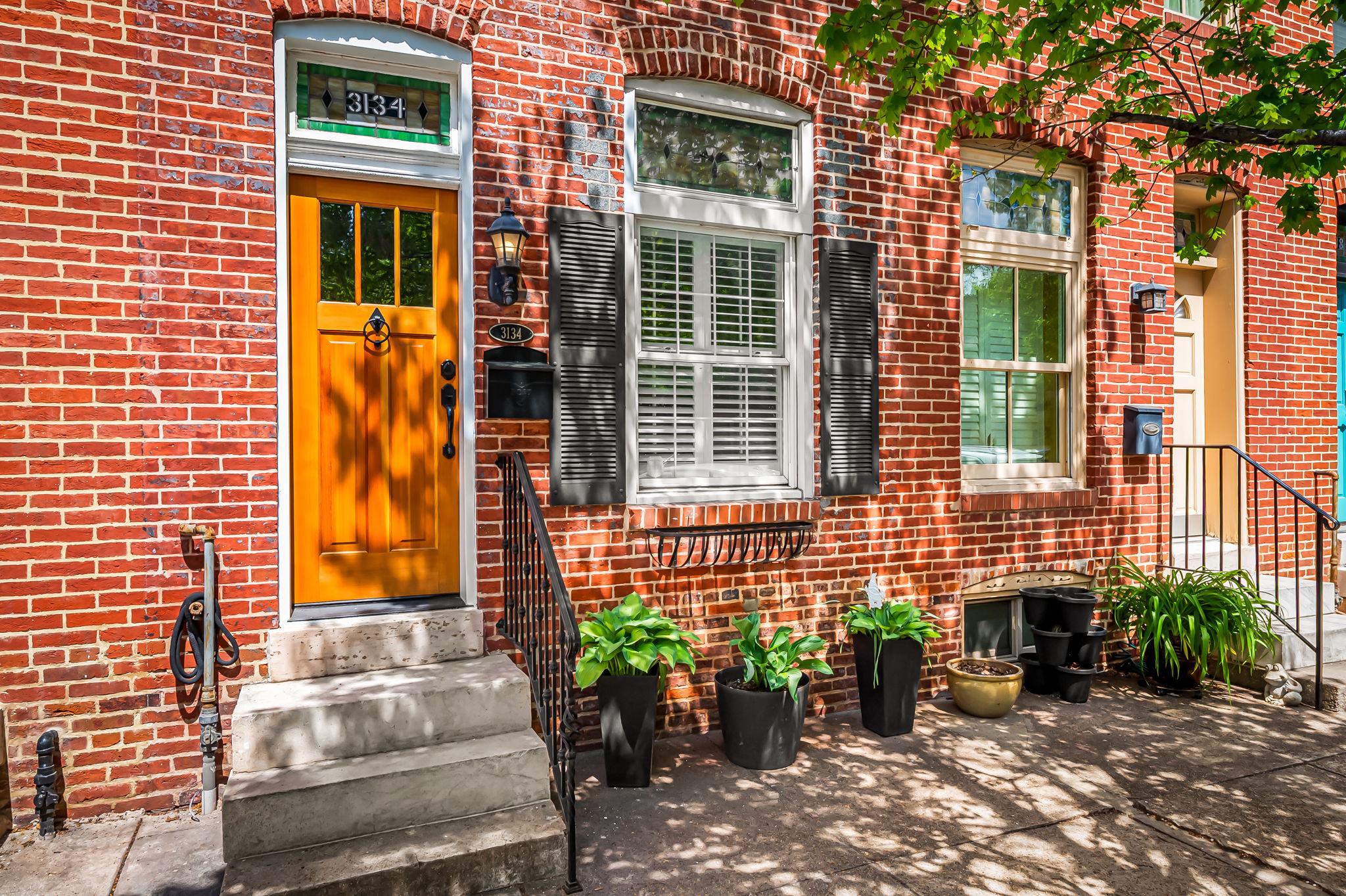 3134 Elliott Street Baltimore, MD 21224 - Photo 2 of 34 a front view of a house having patio