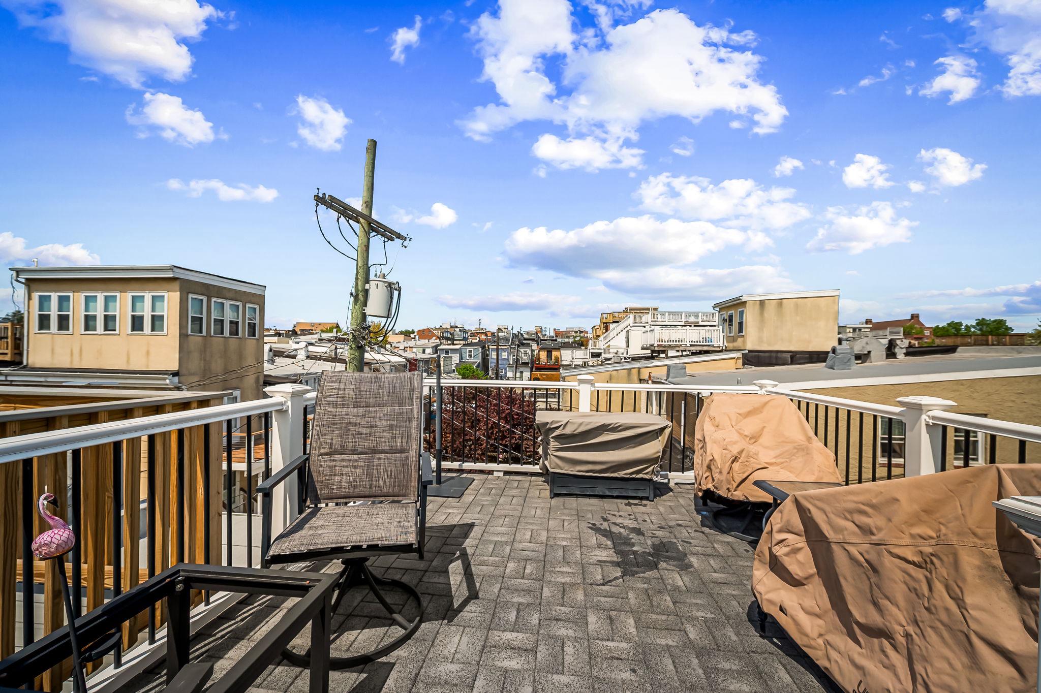 3134 Elliott Street Baltimore, MD 21224 - Photo 26 of 34 a view of a balcony with chairs
